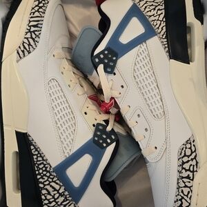 Jordan White and Black Sneakers with Blue Accents